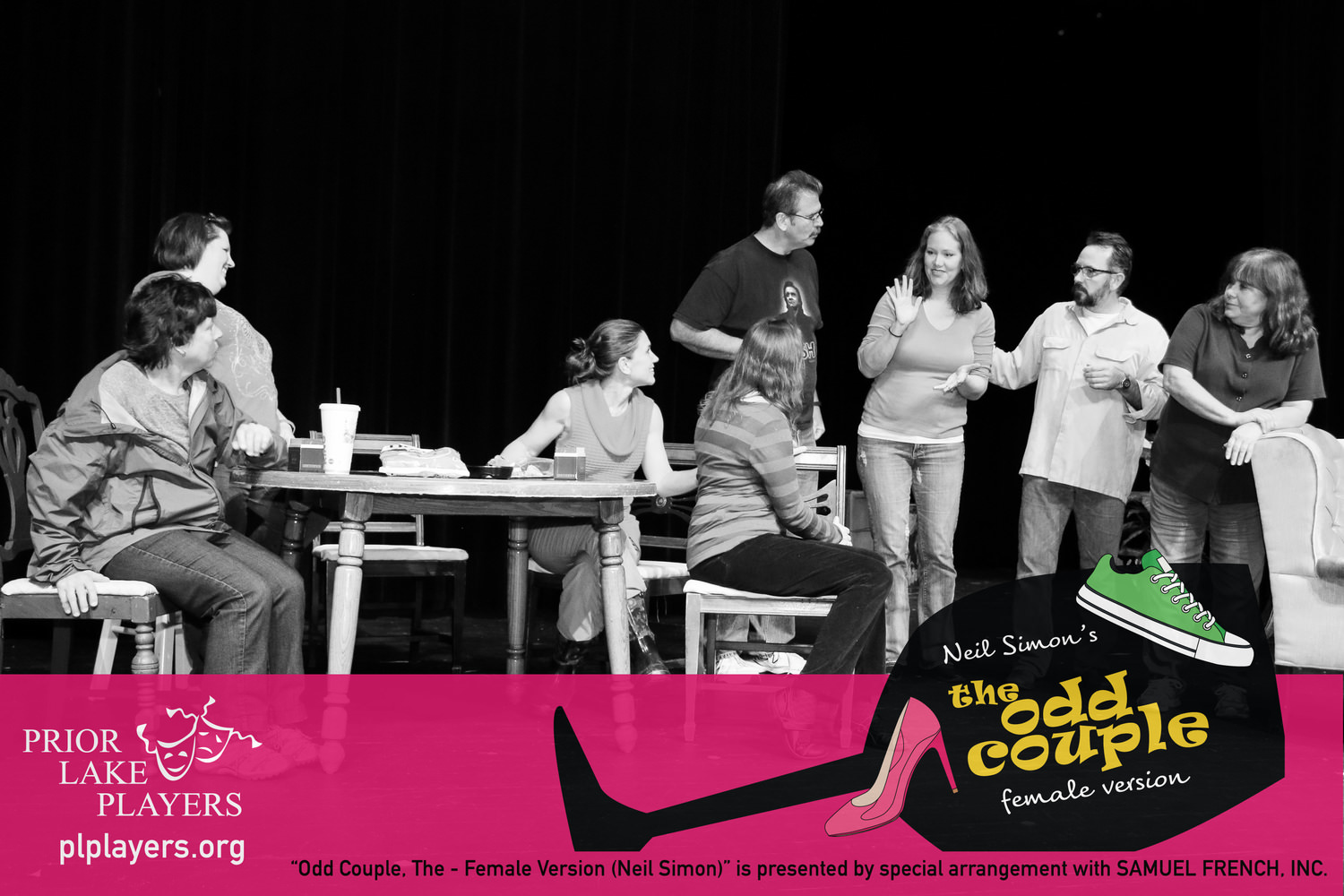 Eight cast members in rehearsal.