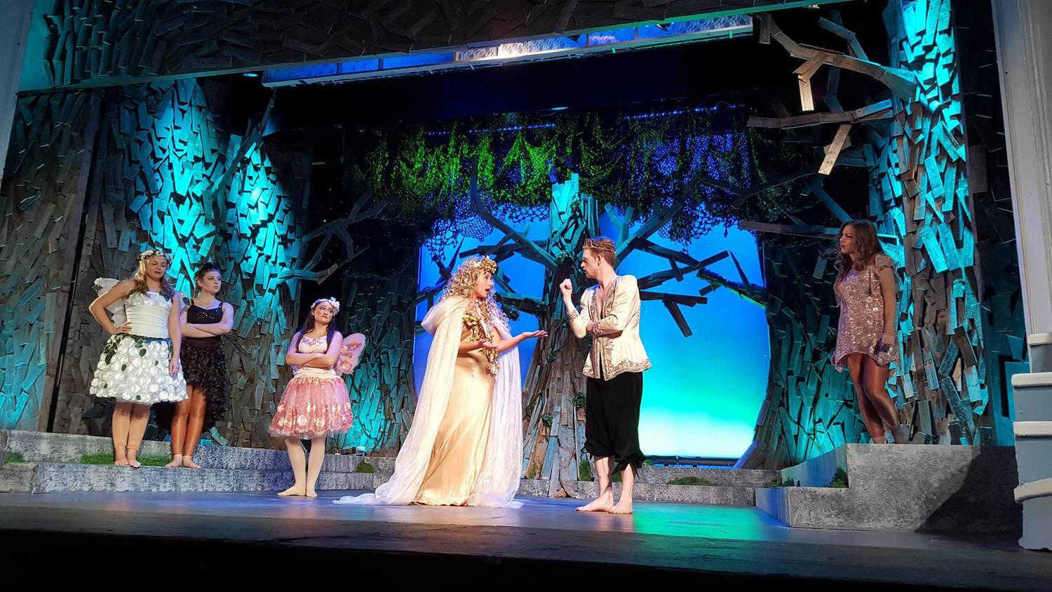 Elizabeth O Brien and Chris Lorenc square off as fairy queen and king, Titania and Oberon, as the fairies (Gina Teschke, Rebecca Madiera, Claudia Noto) and Puck (Mikayla Petrilla) lend their support to their leaders in this iconic scene from 