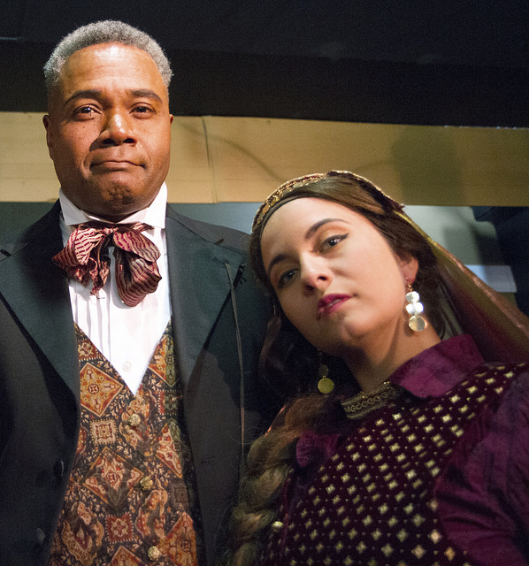 Presenting A Prime Suspect!: Darryl Maximilian Robinson as The Chairman Mr. William Cartwright and Mayor Thomas Sapsea tells us about Anna Galluci as Helena Landless and Miss Janet Conover in the 2018 Saint Sebastian Players of Chicago Revival of Rupert Holmes' 'The Mystery of Edwin Drood'. Photo by Eryn Walanka.