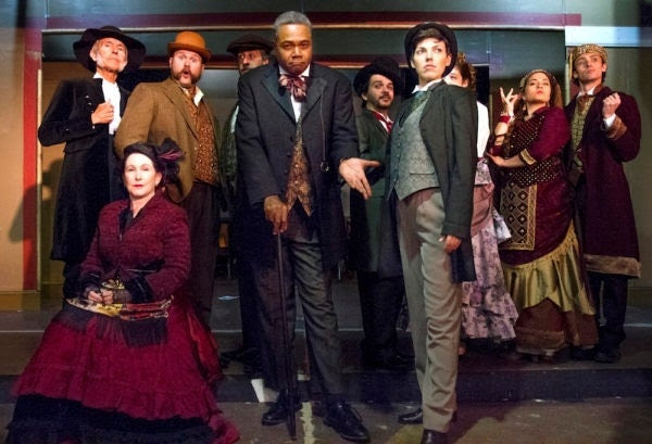 Introducing A Dickens Of A Tale!: Darryl Maximilian Robinson as The Chairman Mr. William Cartwright ( center ) joined by the Principal Cast Members of the 2018 Saint Sebastian Players of Chicago Revival of Rupert Holmes' 'The Mystery of Edwin Drood'. Photo by Eryn Walanka.