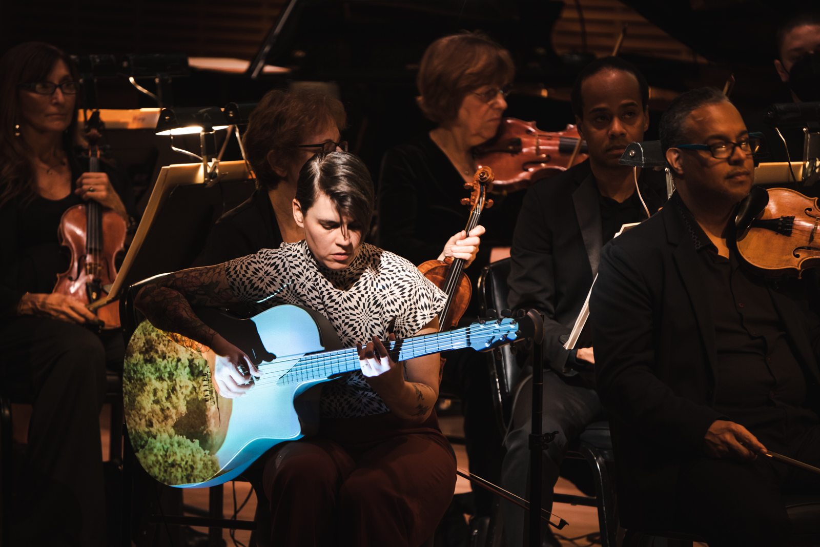 Composer and guitarist Kaki King performing with American Composers Orchestra.