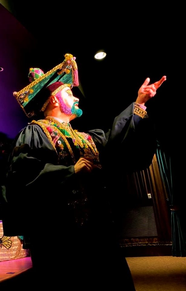 Professor Carl Nivale speaking directly to the audience in the 2020 NORD Theater production.