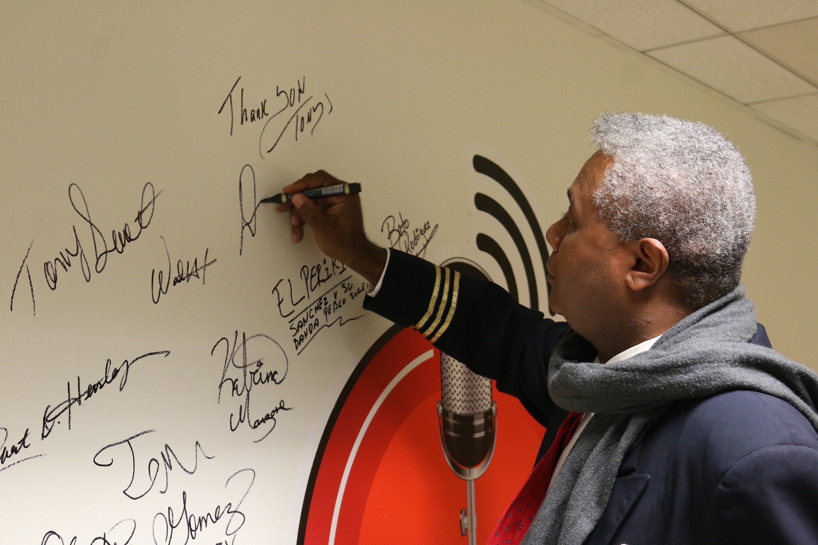 After his fourth appearance on Ron Brewington's 'The Actor's Choice', veteran and award-winning stage actor and play director Darryl Maximilian Robinson was invited to sign the studio's logo wall. Photo by J.L. Watt.