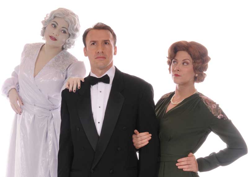 Left to Right: Elvira, the ghostly first wife (Jayna Sweet) with Charles (Murren Kennedy) her past husband and Ruth (Elizabeth Jackson) the current wife in the classic Noël Coward comedy, BLITHE SPIRIT at Lakewood Theatre Company, September 9 - October 16, 2022 in Lake Oswego, Oregon. Photo by Triumph Photography