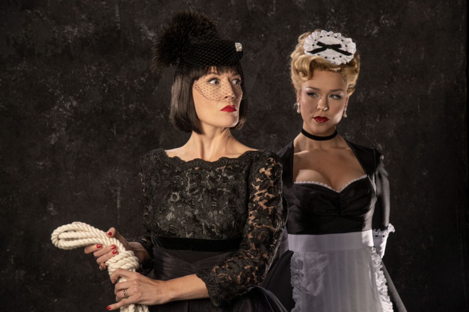 Melinda Parrett (left) as Mrs. White and Bailey Blaise as Yvette in the Utah Shakespeare Festival’s 2022 production of Clue. (Photo by Karl Hugh. Copyright Utah Shakespeare Festival 2022.)