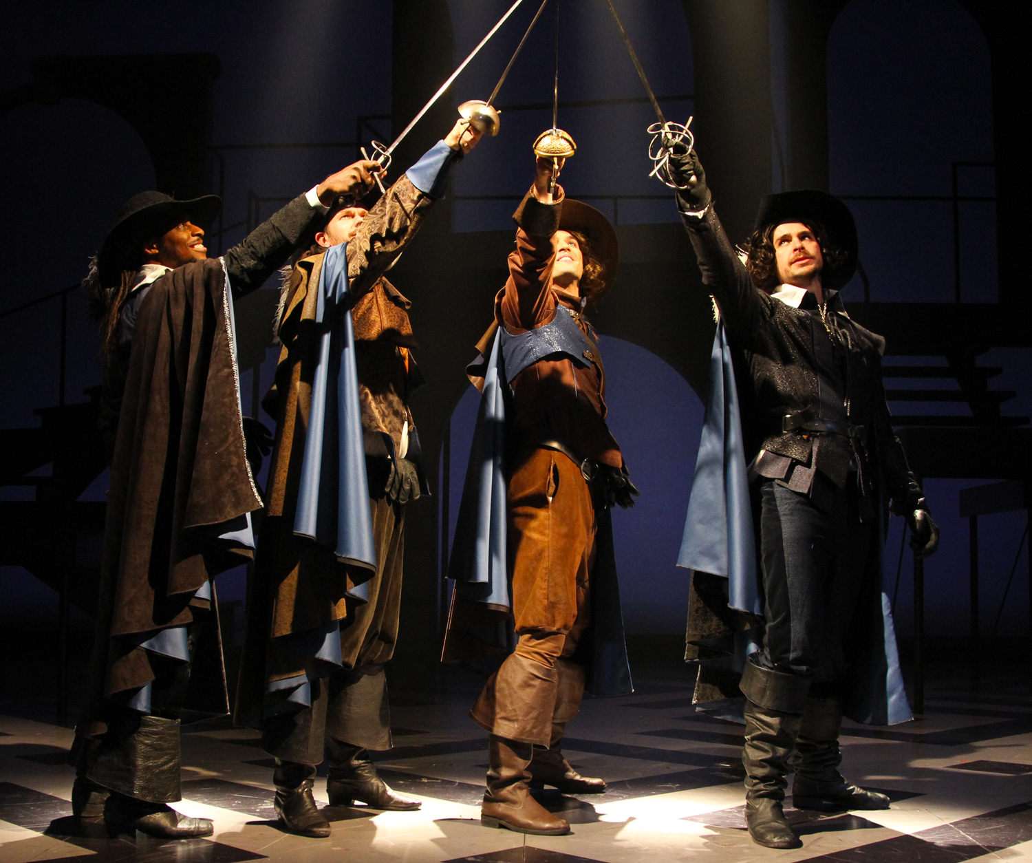“All for One” L to R: Thomas Brazzle (Athos), Anthony J. Goes (Porthos), Will Haden (D’Artagnan) and James Jelkin (Aramis) star in The Three Musketeers at Connecticut Repertory Theatre from November 21 through December 8 in the Harriet S. Jorgensen Theatre, Storrs, CT. Photo by Gerry Goodstein.