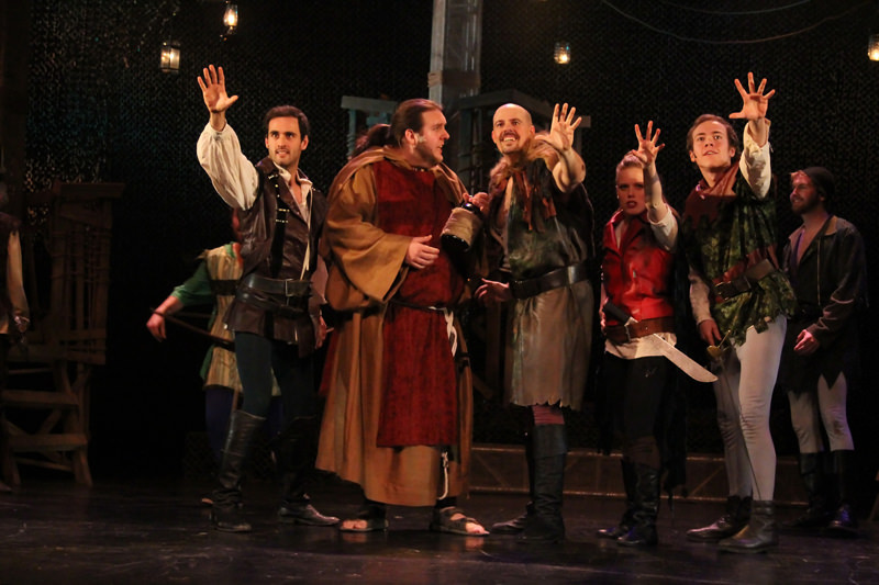 Robin Hood (Daniel James) and the Merry Men try to convince Friar Tuck (Benjamin Kyte) to join them.
Photo by: Daniel DiMarco 1