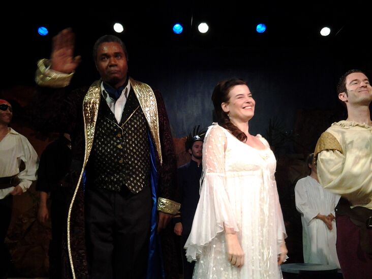 Like A Good Soldier, By Curtain Call, Mabel Stanley Gets Her Man!: With the approval of Darryl Maximilian Robinson as her father, Major-General Stanley, Jennifer Sperry as Mabel Stanley joins her future husband Chris Yeschenko as Fredric during the final moments of the 2014 San Pedro Theatre Club's 135th Anniversary Revival Production of Gilbert and Sullivan's 'The Pirates of Penzance'. Photo by Ruth Featherstone. 