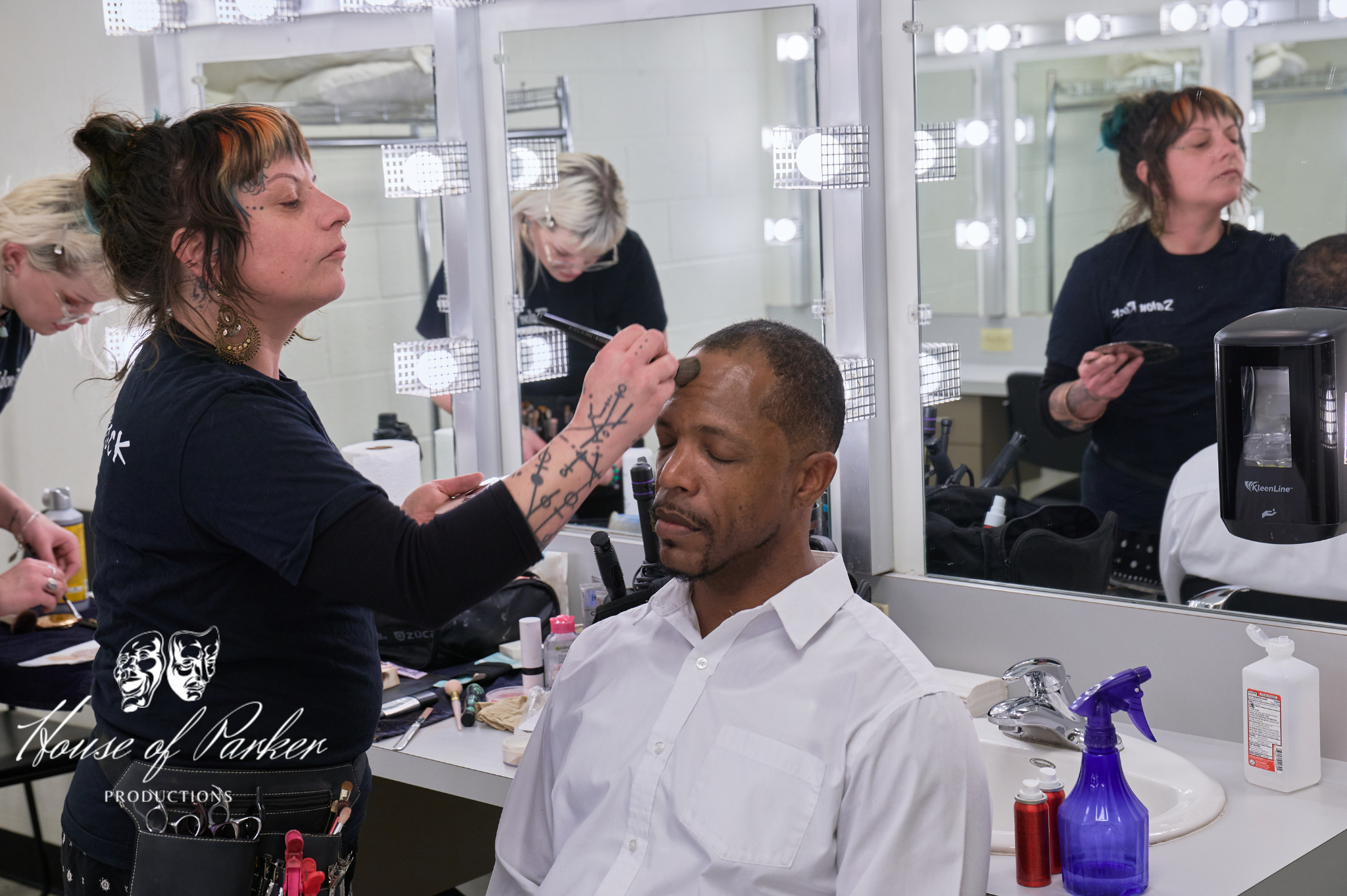 A behind-the-scenes moment with Aaron Brown in hair and makeup prior to the show. A behind-the-scenes moment with Aaron Brown in hair and makeup prior to the show.