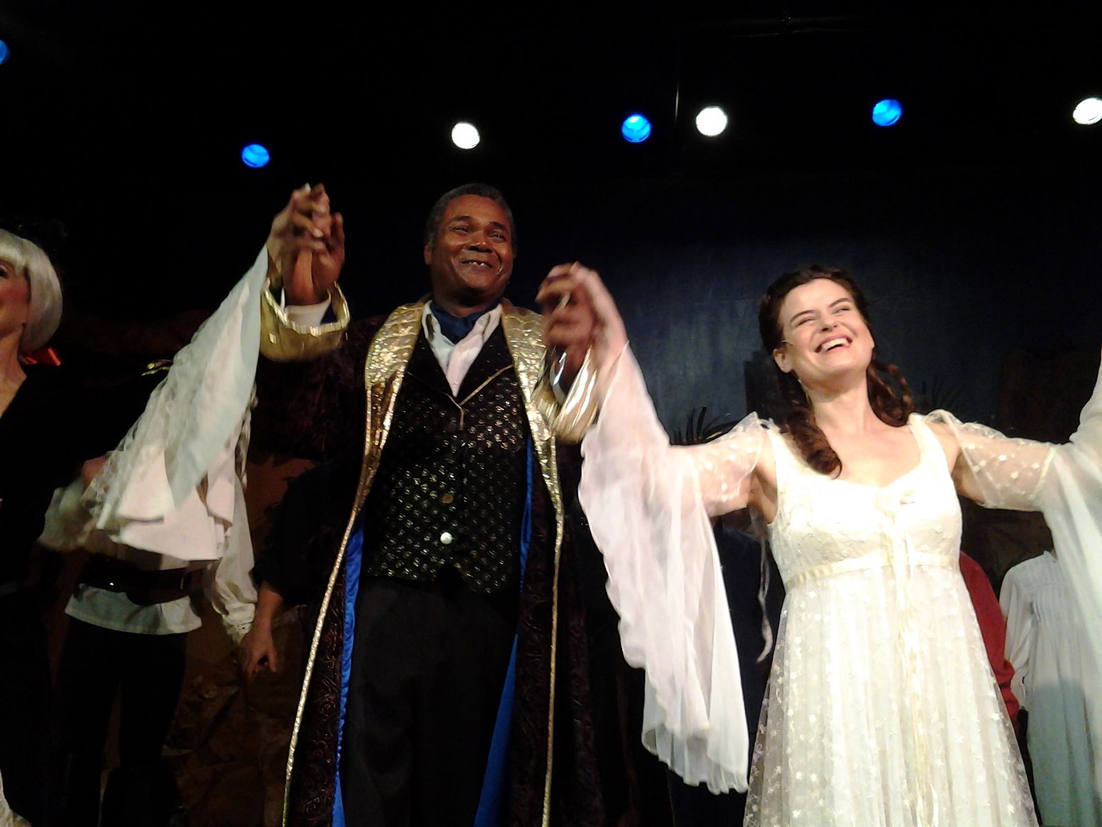 It's Nice To Share A Curtain Call With Family: Joined by the entire talented cast, Jennifer Sperry as Mabel Stanley and Darryl Maximilian Robinson as Major-General Stanley take their bows in the 2014 San Pedro Theatre Club's 135th Anniversary Revival Production of Gilbert and Sullivan's 'The Pirates of Penzance'. Photo by Ruth Featherstone.