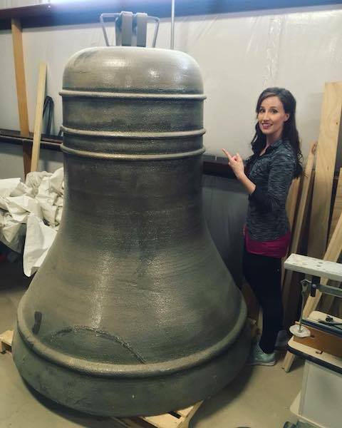 One of 6 large bells in the tower of Notre Dame during set construction for the production. Hannah Marie Harmon (Esmeralda) next to it for some scale. 1