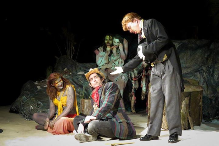 Ariel (Kate Bunce) looks on, as Stephano (Scott Hoffman) reaches out to Trinculo (Johnny Peifer), with Caliban (Tony Palmieri) and Sycorax (Kelley Mountzoures) lurking in the shadows.