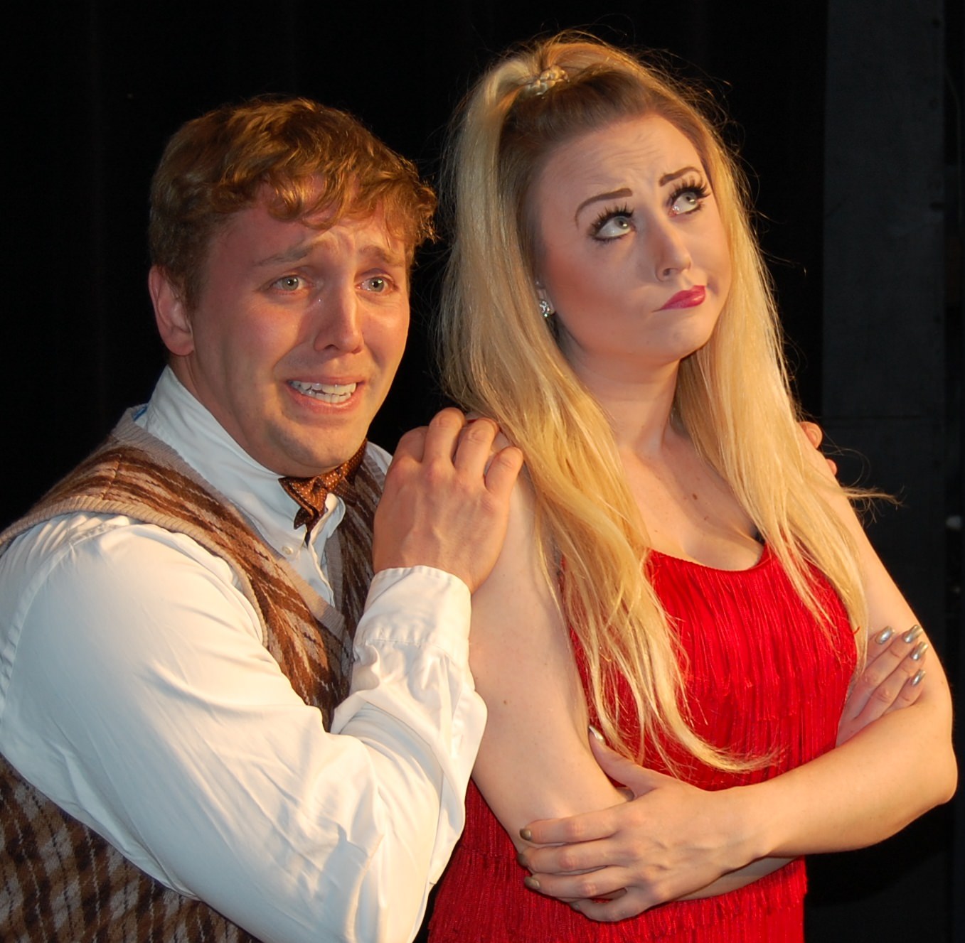 Charity (Lori Smith) contemplates if Oscar (Zak Shugart) is the guy for her in the musical Sweet Charity