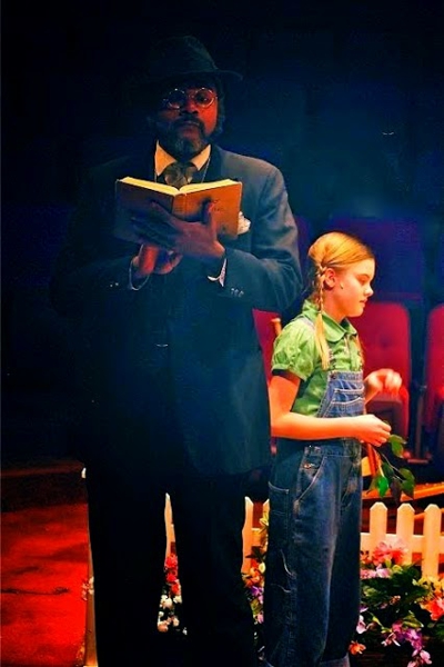 Talking About Town Troubles: Darryl Maximilian Robinson as The Reverend Sykes and Camille Gibney as Scout Finch in the 2011 Glendale Centre Theatre of Glendale, Ca. staging of To Kill A Mockingbird.