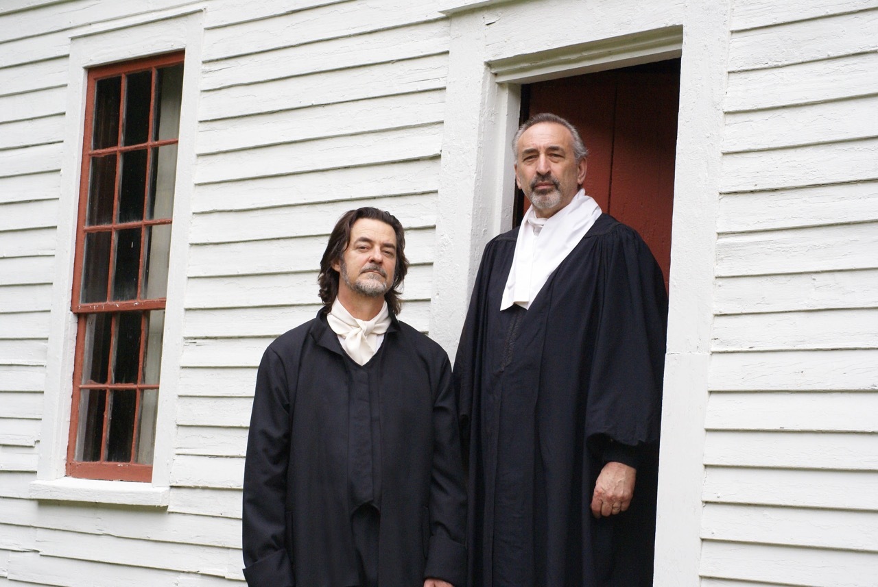Nathaniel Saltonstall (Douglas Brendel, of Ipswich, MA ) and Reverend John Ward (Les Tarmy, of Nahant, MA) in the doorway of the John Ward house on the grounds of the Buttonwoods Museum, Haverhill MA (the homestead of the Saltonstall Family. 