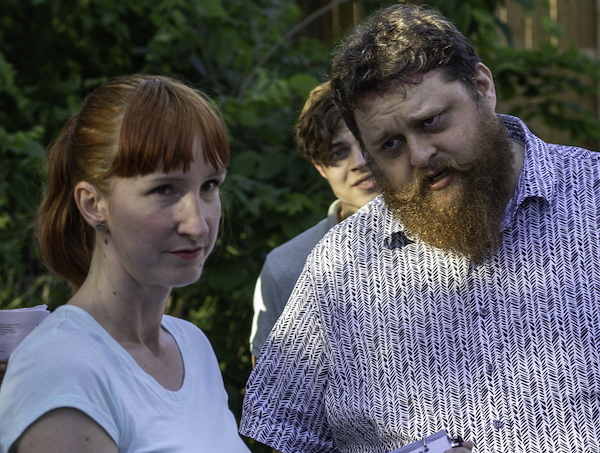 Beatrice (Laura Kochanowski) and Benedick (Britton Rea) square off, with Claudio (Henry Zavos) looking on.