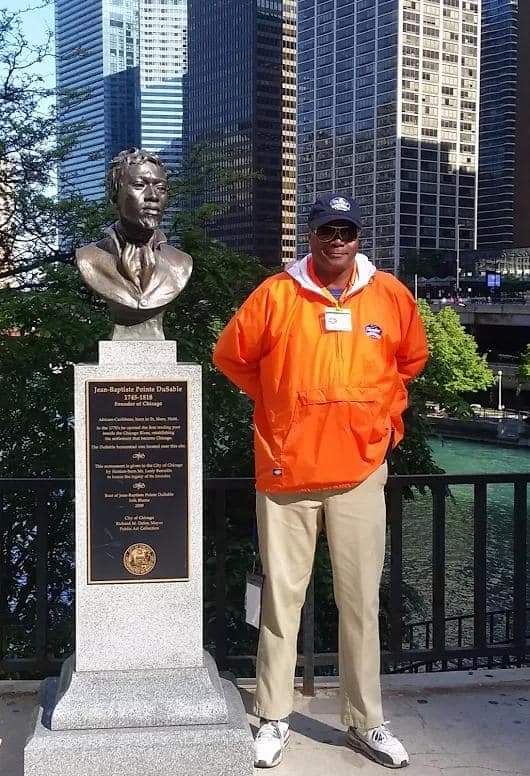 Historic Art: On The Magnificent Mile beside a bust of the Chicago Founder, in 1983, Darryl Maximilian Robinson played Jean Baptiste Pointe DuSable in the one-act play Chicago: A Tale of One City.