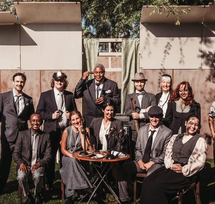 Surrounded By Newsmakers: Darryl Maximilian Robinson ( second row, center ) as Roy V. Bensinger joined by Principal Cast Members of The Culver City Public Theatre 2024 revival of THE FRONT PAGE.