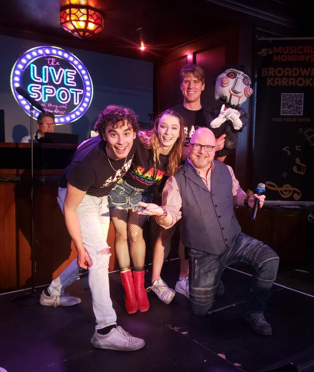 Jack Cathcart (AdaM), Alyssa Corella (Jigsaw/Amanda), and Riley Nottingham (Dr. Gordon) perform at Musical Mondays at the Abbey in West Hollywood Jack Cathcart (AdaM), Alyssa Corella (Jigsaw/Amanda), and Riley Nottingham (Dr. Gordon) perform at Musical Mondays at the Abbey in West Hollywood