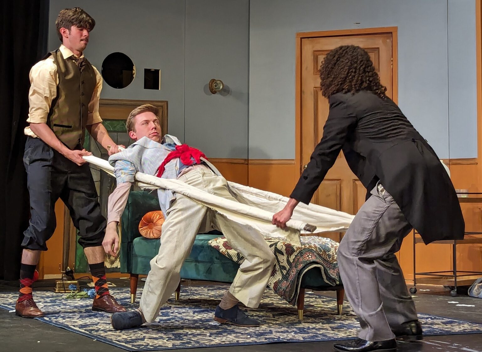 Production Photo. Play That Goes Wrong Company. (Left to Right: Tristan-Teja McDaniel, Casey Kassal, & Tyler Rainer)