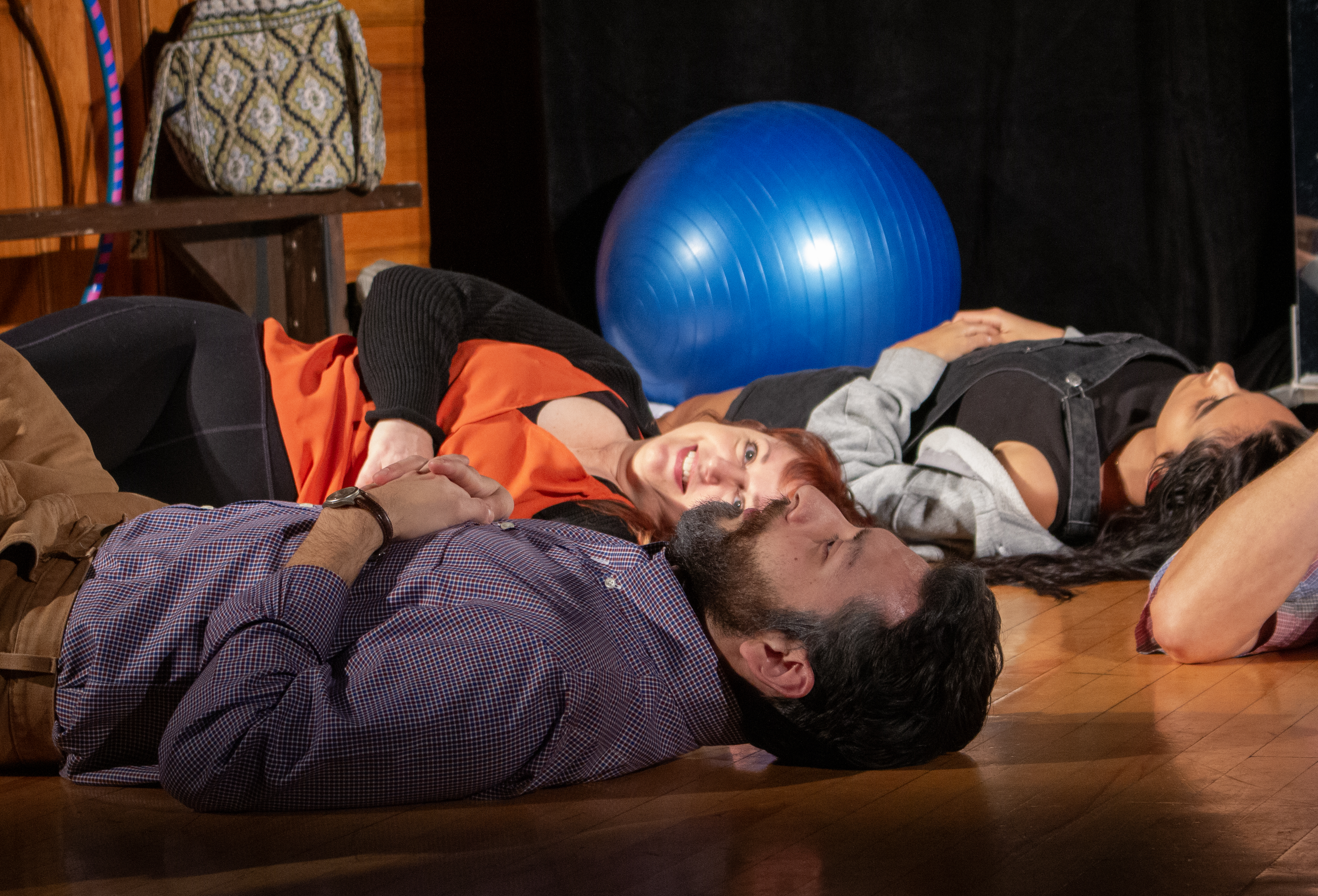 Theresa (Kym Taylor) gazes at Schultz (Chris Acosta) in Circle Mirror Transformation with The Shelburne Players.