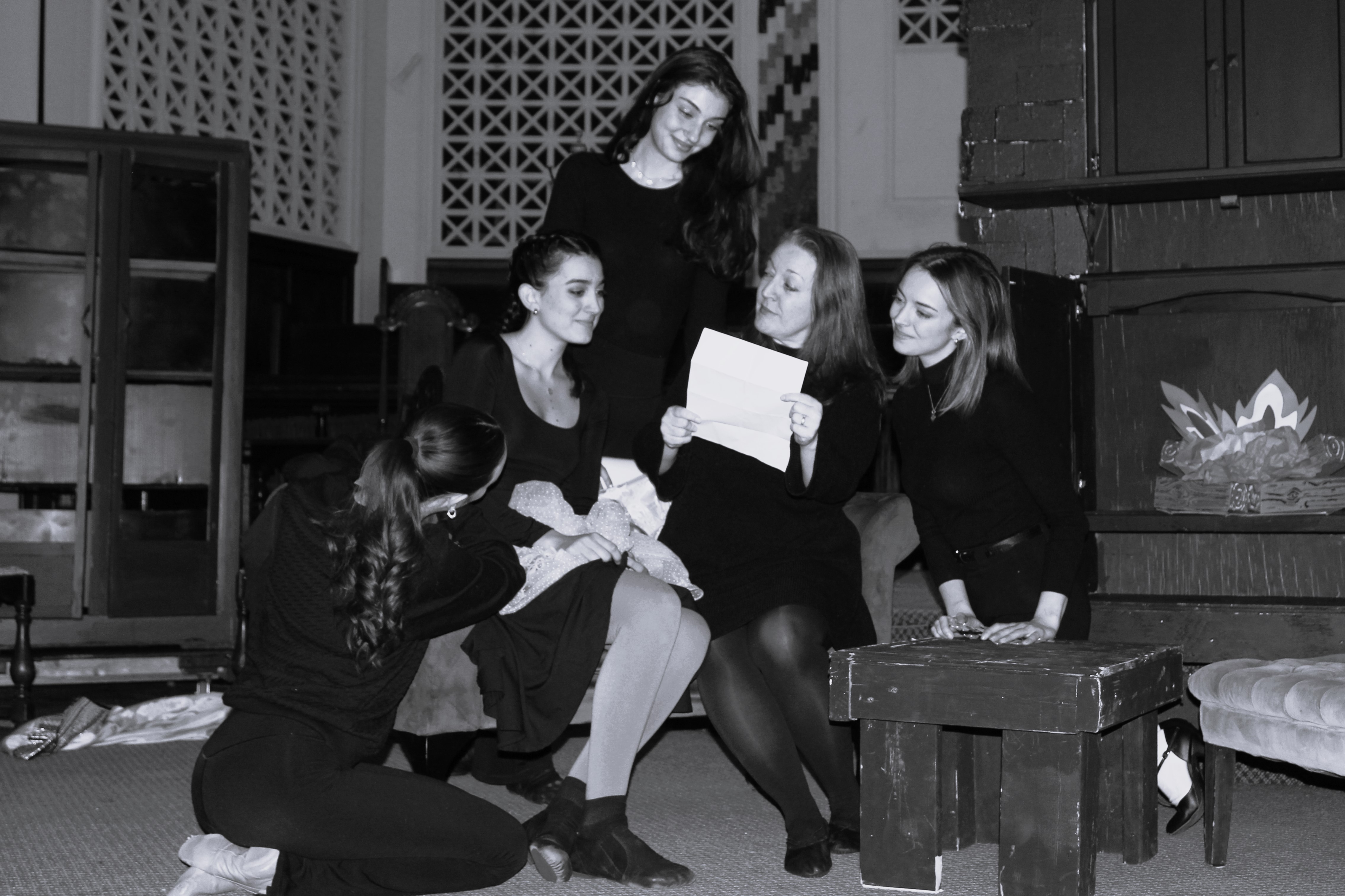 The March women read a letter from their father. From bottom left: Alex Pearce as Beth March; Freya Maria as Amy March; Jo lle Arianna Staropoli as Jo March; Danielle Young-Ullman as Marmee March; and