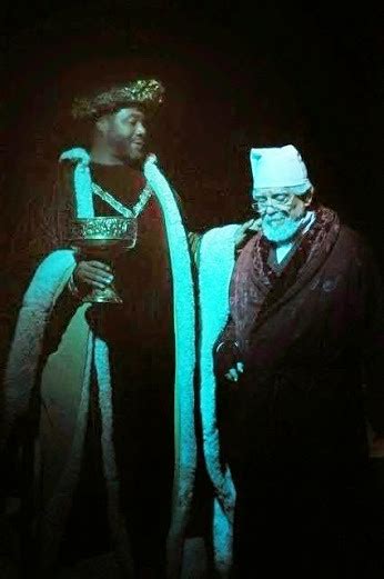A Comforting Spirit: Darryl Maximilian Robinson as The Ghost of Christmas Present and Mario Di Gregorio as Ebenezer Scrooge in the 2010 A Christmas Carol.