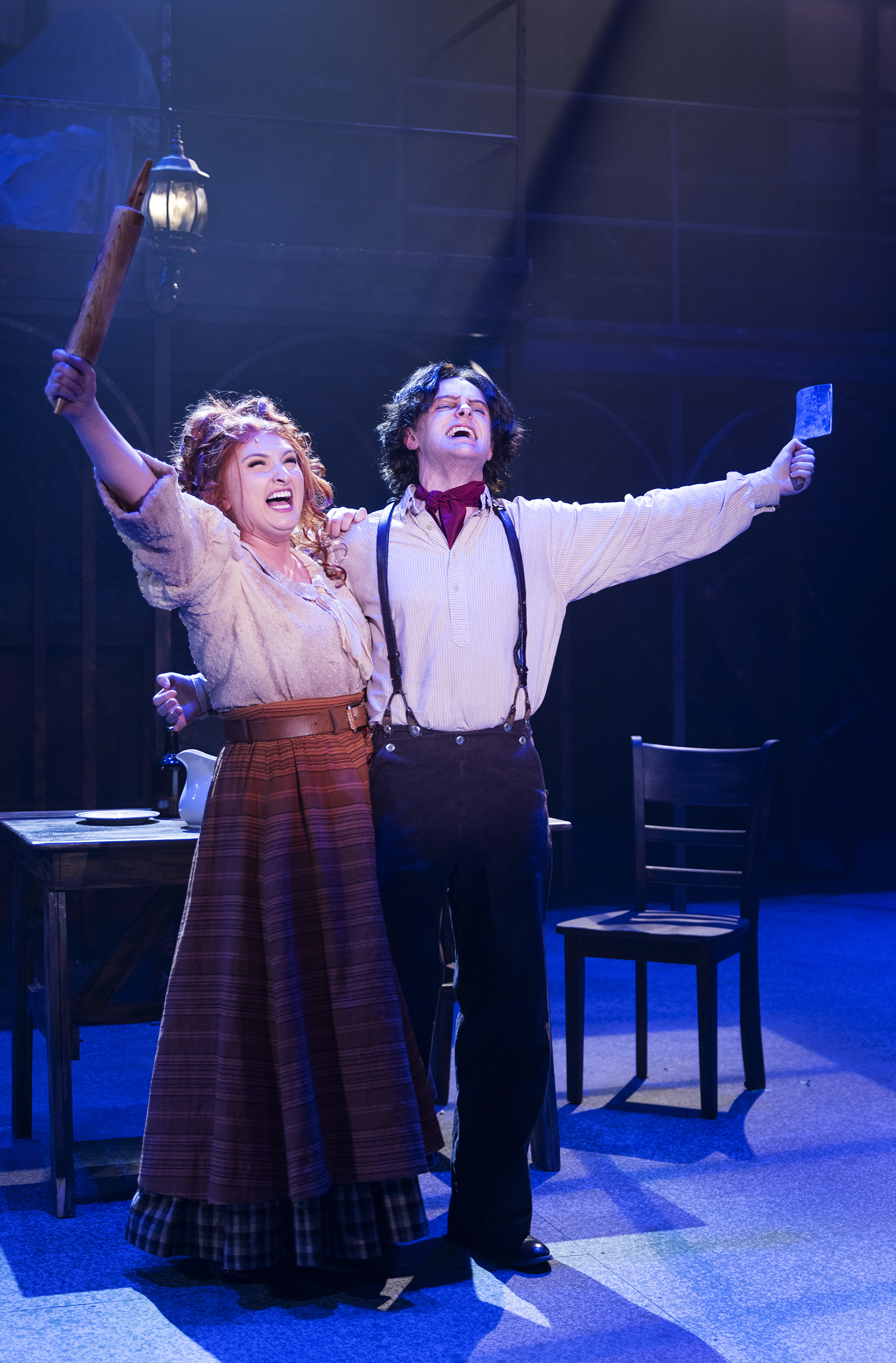 Mrs. Lovett (Grace Gebara) and Sweeney Todd (James Kelley Carroll). Photo by Tim Fuller. Scenic Design by Joe C. Klug. Costume Design by Patrick Holt. Lighting Design by Ken Phillips. Sound Design 