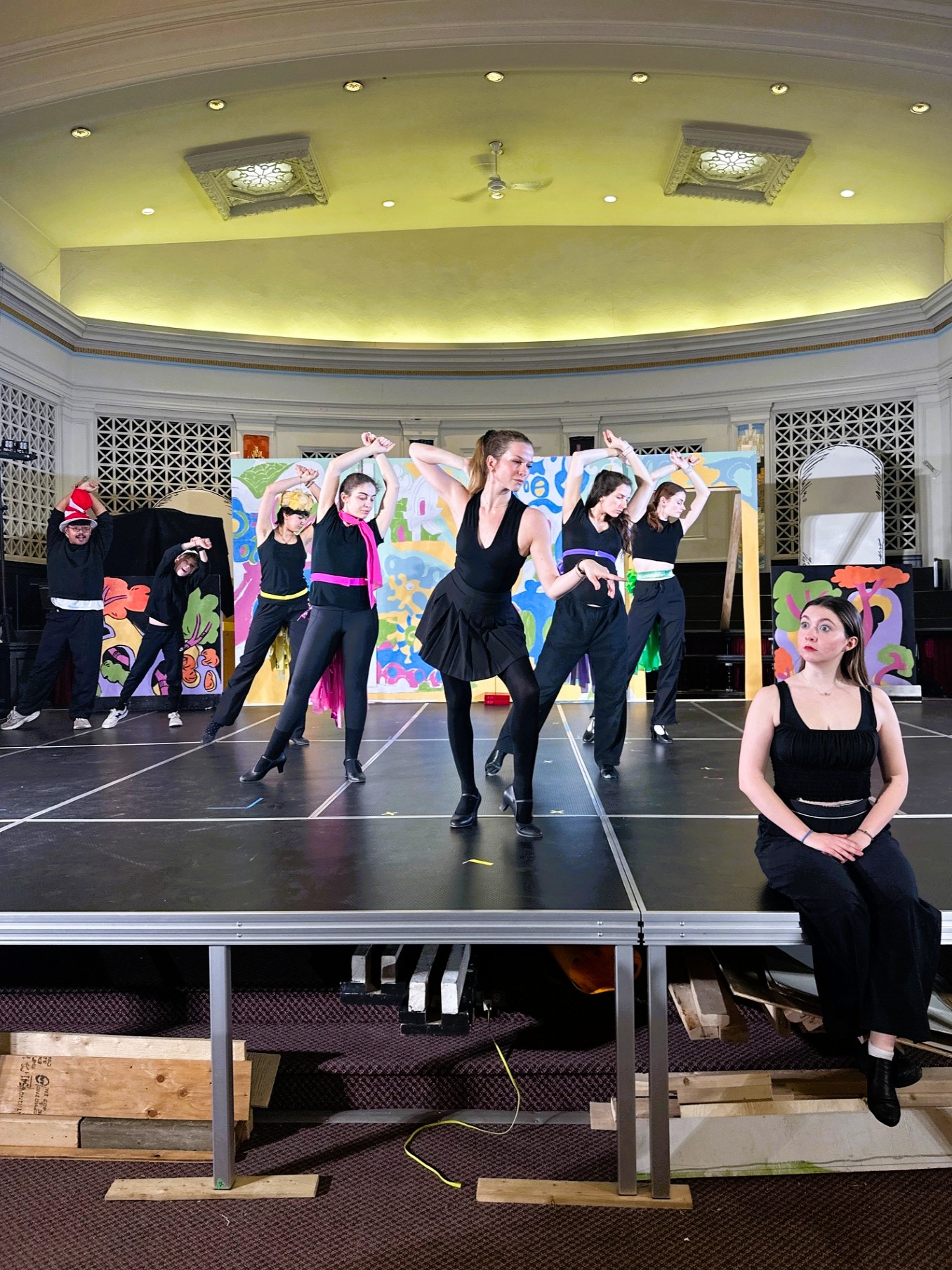 Mayzie and the Bird Girls educate Gertrude on tail feathers.   L-R: Neil-Erine Palmaria, Eytan Marcus-Wolpert, Sophia Kot, Jaelynne Gervais, Lauren Franzoni, Kayla Calof, Erin Smith and Tessa Saville