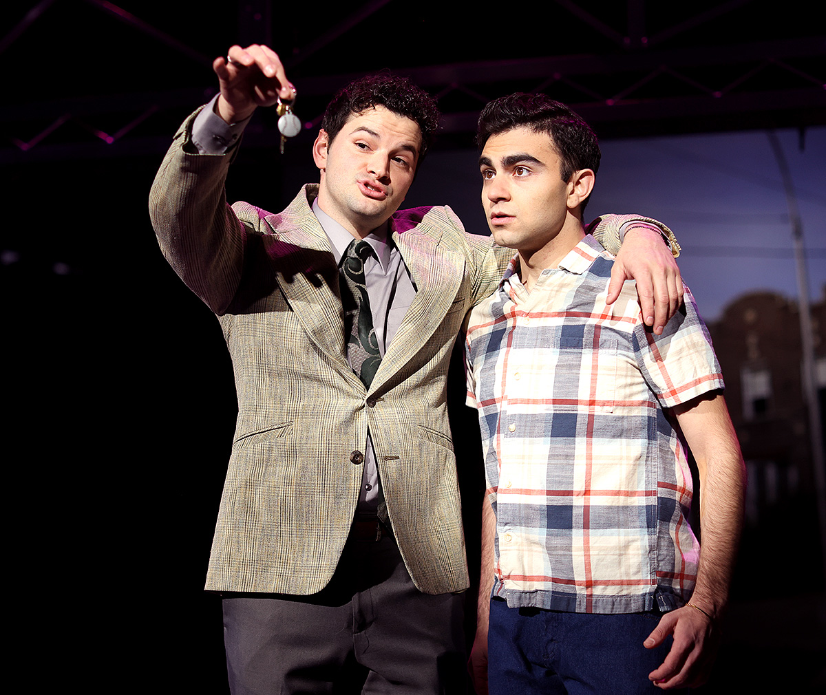 Tommy DeVito (Kyle Southern), left, dangles his car keys in front of Frankie Valli (Gian Raffaele DiCostanzo) in an attempt to bribe him in Beef & Board Dinner Theatre''s production of Jersey Boys, no