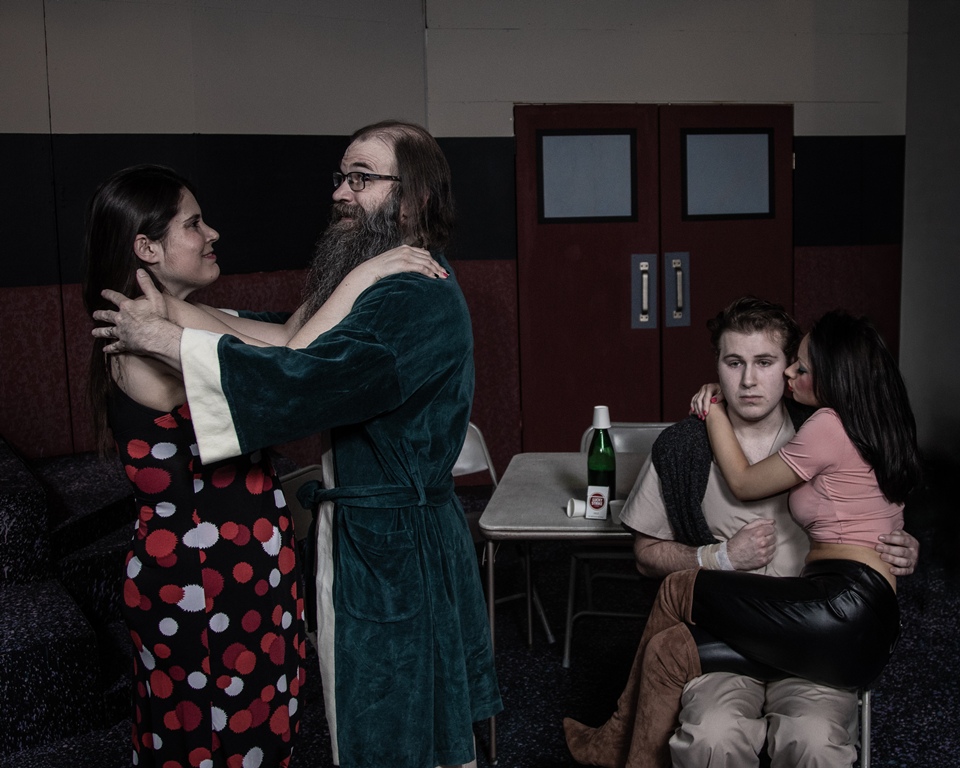Nicole Shaw as Sandra and Chris Boerner as Scanlon dance as Juliana Penney as Candy Starr cuddles on the nervous lap of Billy Bibbit portrayed by Cole Kaelin.