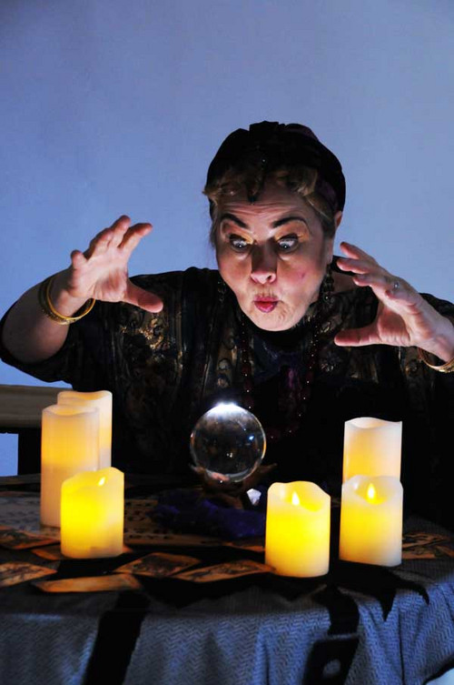 Madame Arcati (Caren Graham) summons the spirits in the classic Noël Coward comedy, BLITHE SPIRIT at Lakewood Theatre Company, September 9 - October 16, 2022 in Lake Oswego, Oregon. Photo by Triumph Photography 1