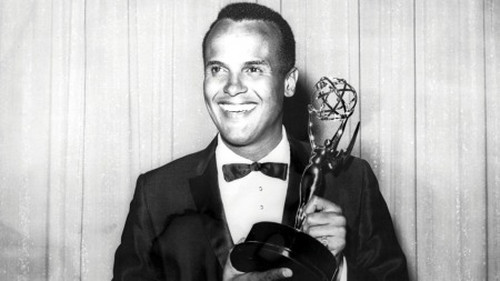 AMERICA'S FIRST AFRICAN-AMERICAN MALE PERFORMER TO WIN THE EMMY!: Here is the legendary star Harry Belafonte with his 1960 Emmy Award as Outstanding Performer for his 1959 television music special 