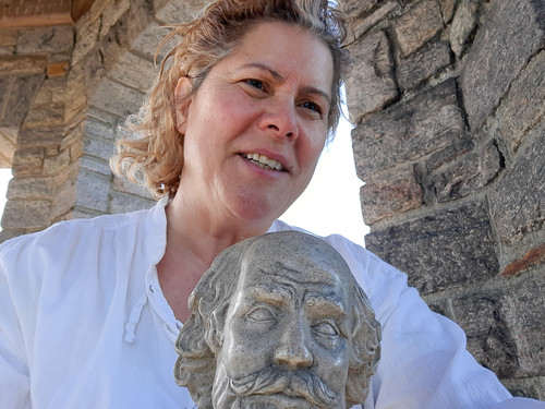 Narrator Maryann Penzero poses with a bust of Shakespeare during filming. (photo credit: MaryAnn Penzero) 1