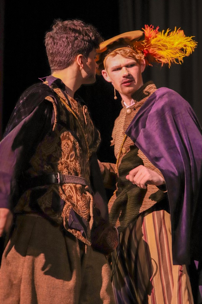 Rosencrantz (Jack Andersen) observes a coin. 7