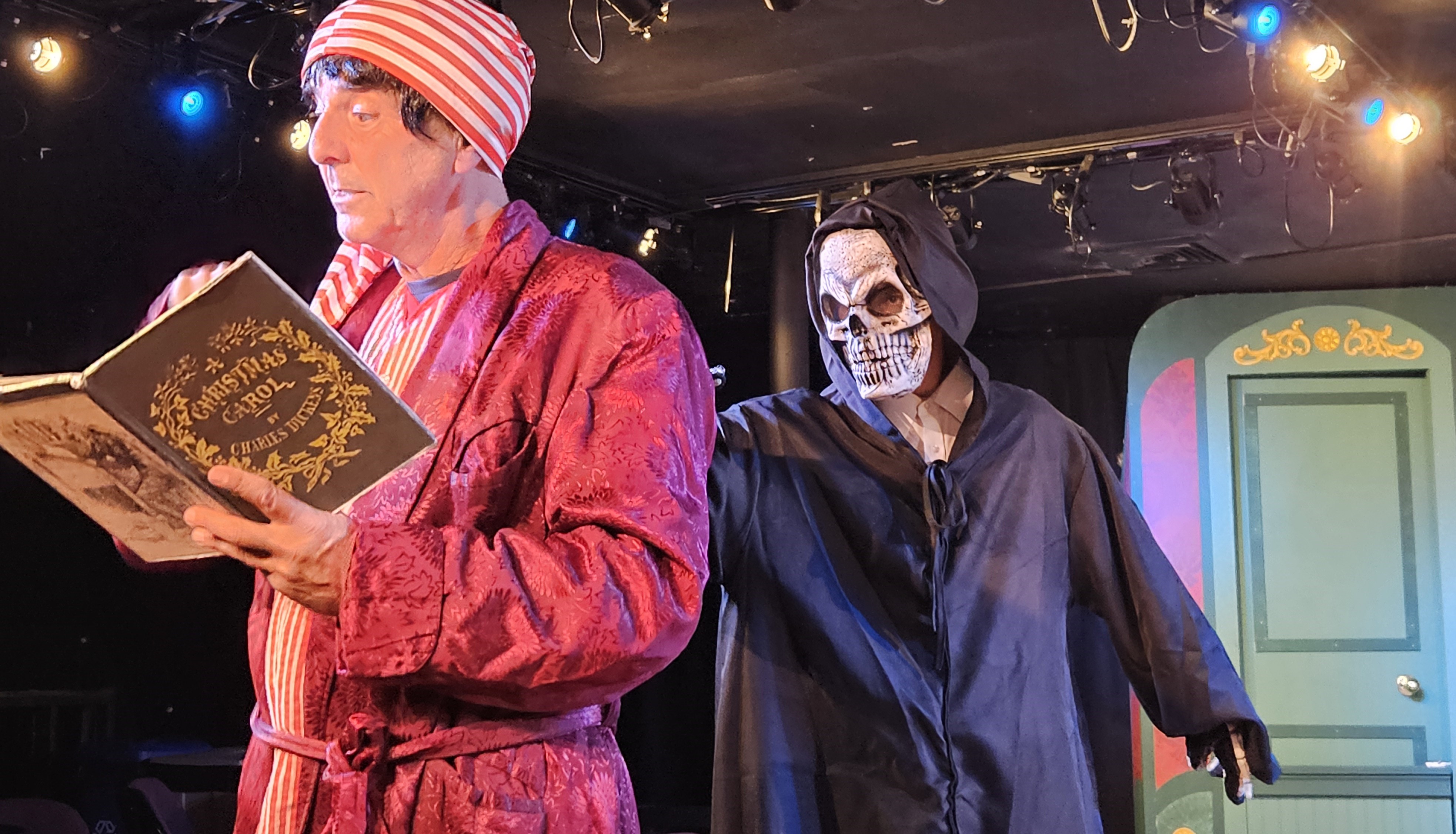 Ebenezer Scrooge is visited by the most fearful ghost of all in THE THREE SCROOGES at Curtain Call...a madcap musical romp playing in The Dressing Room Theatre. (Michael Pelazza and The Ghost)