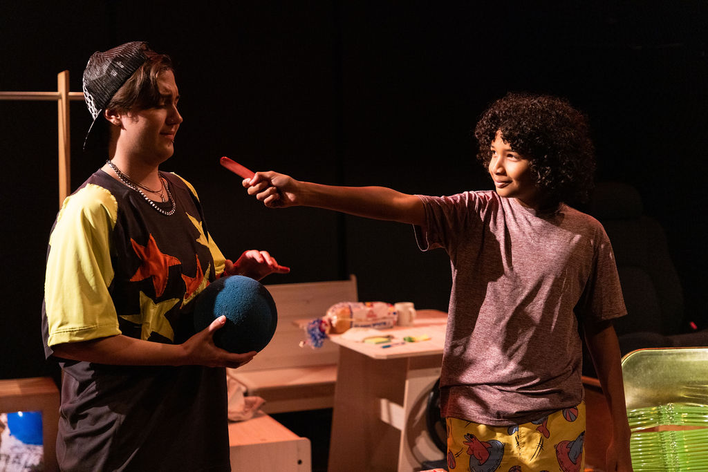 Max Lerin (Bean) and Emperor Kaioyus (Spoon) in Pearls for Spurs by Gates Leonard at The Jeffrey and Paula Gural Theatre at the A.R.T./New York Theatres, photo by Whitney Browne Photography, directed by Luke Landric Leonard, produced by Monk Parrots