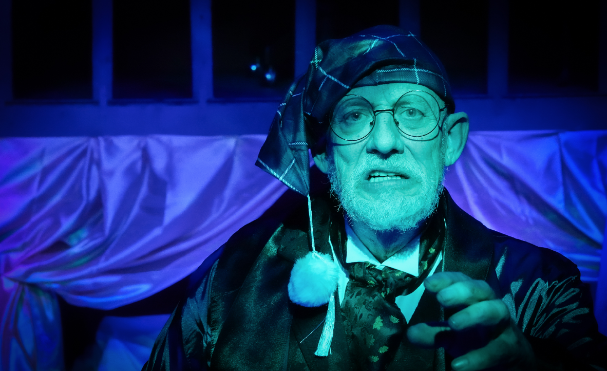 Richard Mazda as Ebenezer Scrooge