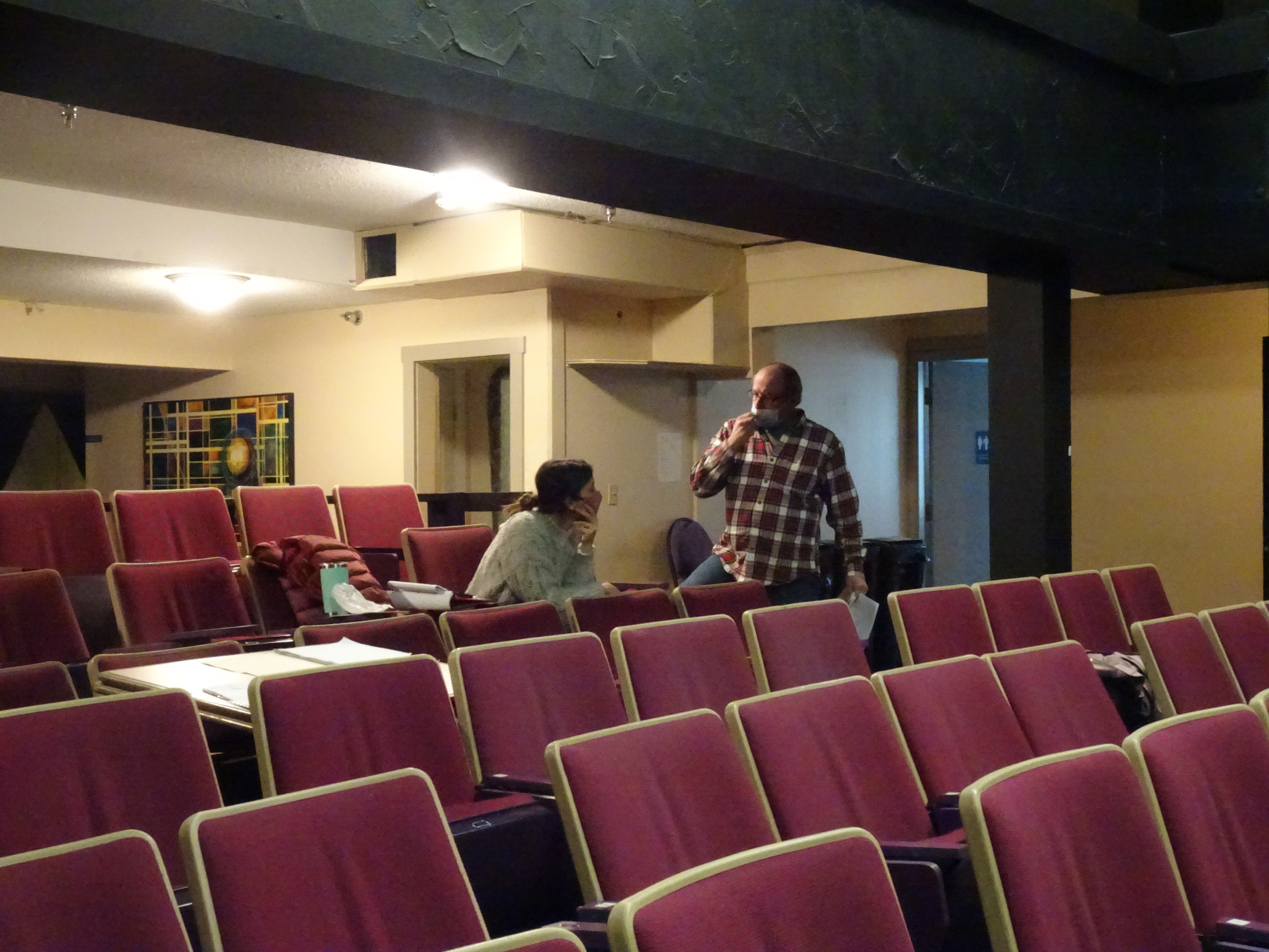 Director Brianna Hamilton and lighting designer Erik Tully confer during a break