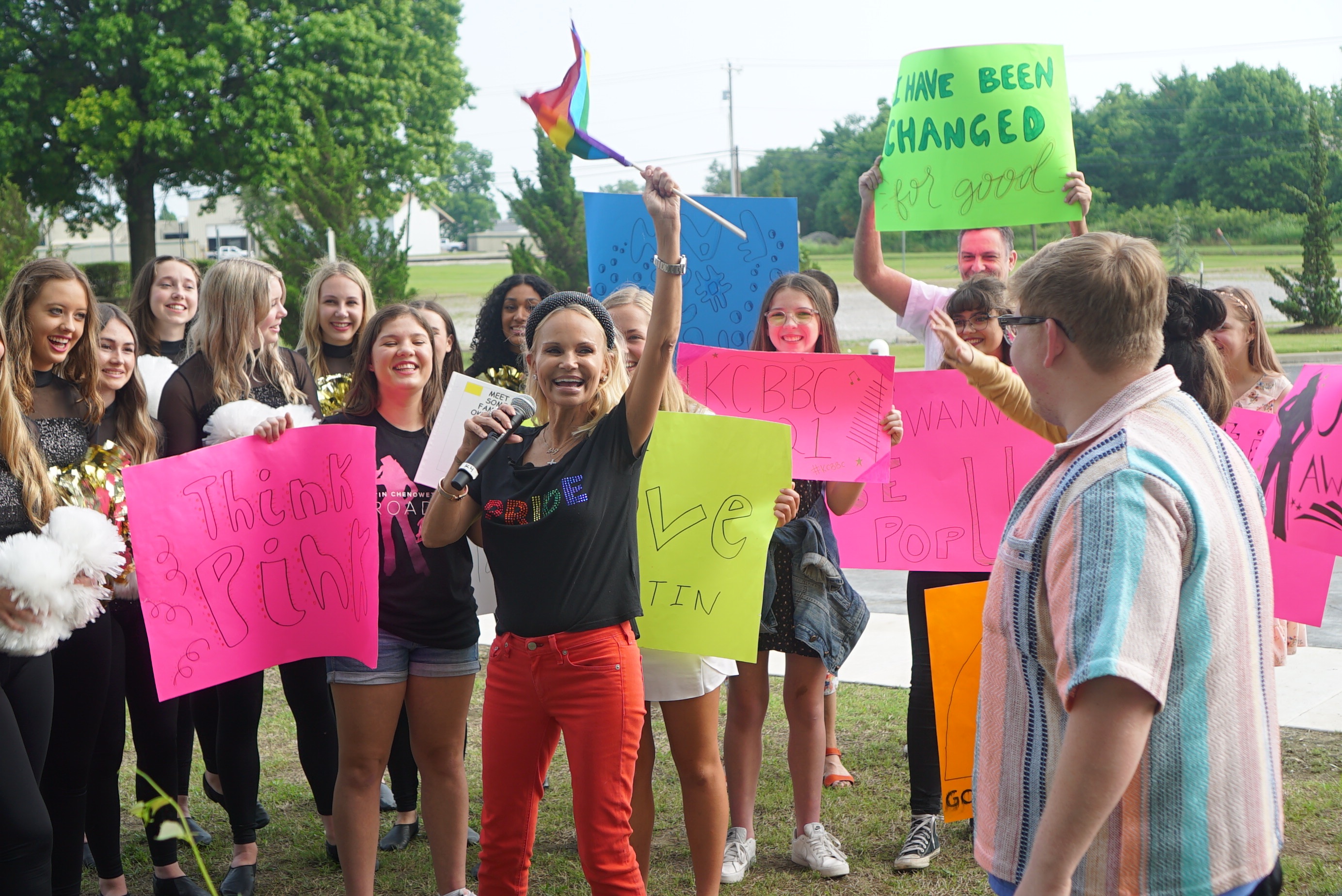 Kristin Chenoweth waves a flag for Pride while greeting fans. Photo Credit: Merrill Mitchell