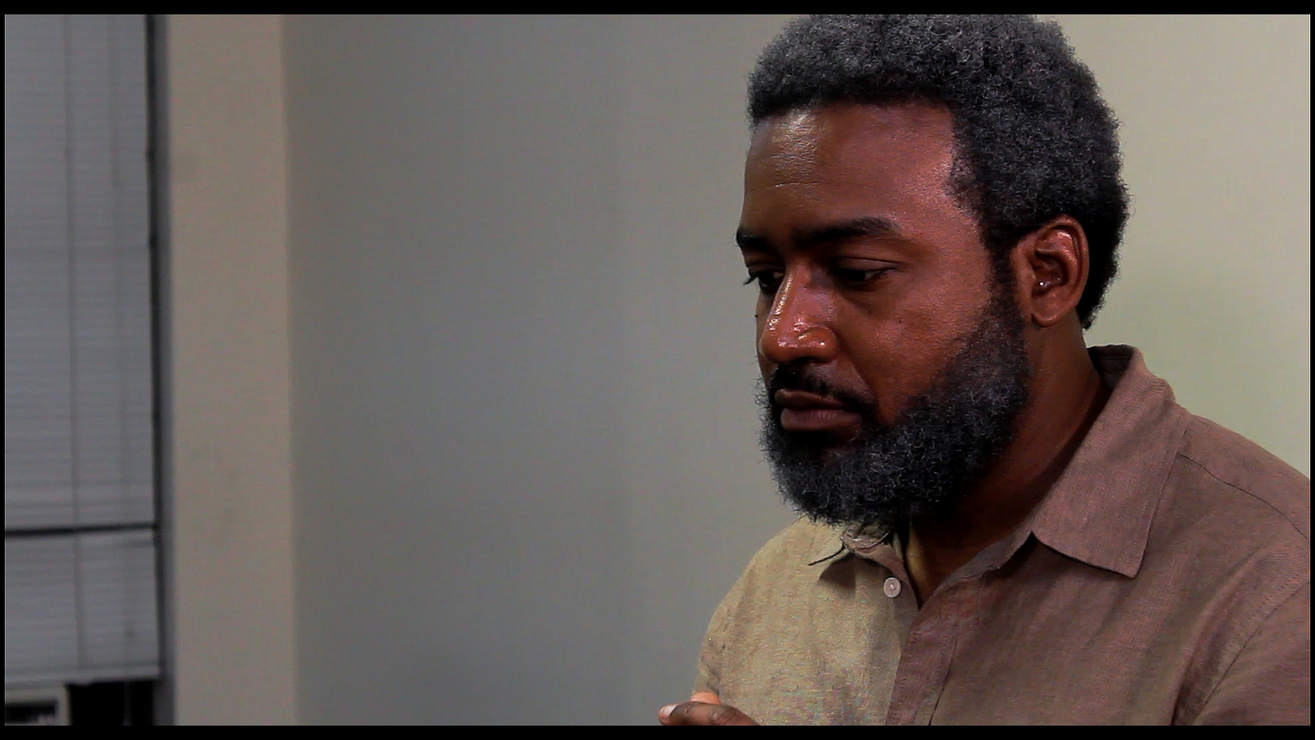 Lionel Russell (Khalif Cotton) remembers his past.