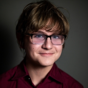Eliot Best (he/him) - Thalia, Muse of Comedy