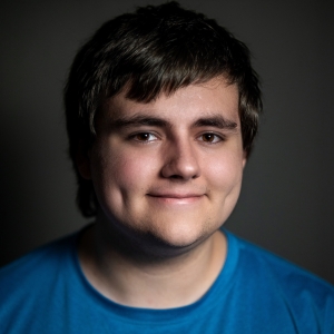 Surya DeWeese (he/they) - Zeus/Greek Chorus