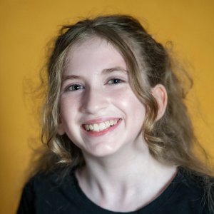 Lucy Cohen (she/they) - Tommy