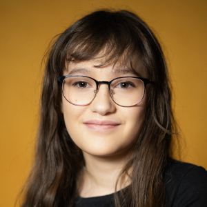 Nora McKinstry (they/them) - Juno