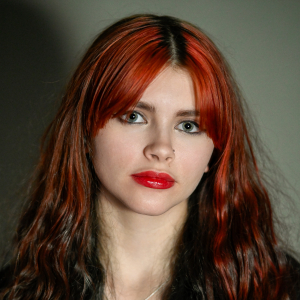 Issabella Conroy (they/them) - Assistant Director