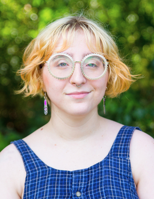Em Hausmann - Director