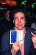 Mario holding up a gift, an original playbill from the Off-Broadway Production  Photo