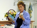 Amanda McBroom (as Kate) tries to decide between liquor and water
before sitting dow Photo
