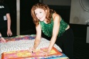 Victoria Clark signing a quilt to be auctioned off for the victims of Hurricane Katri Photo